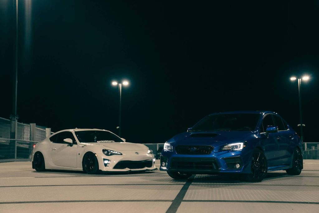 white toyota blue subaru